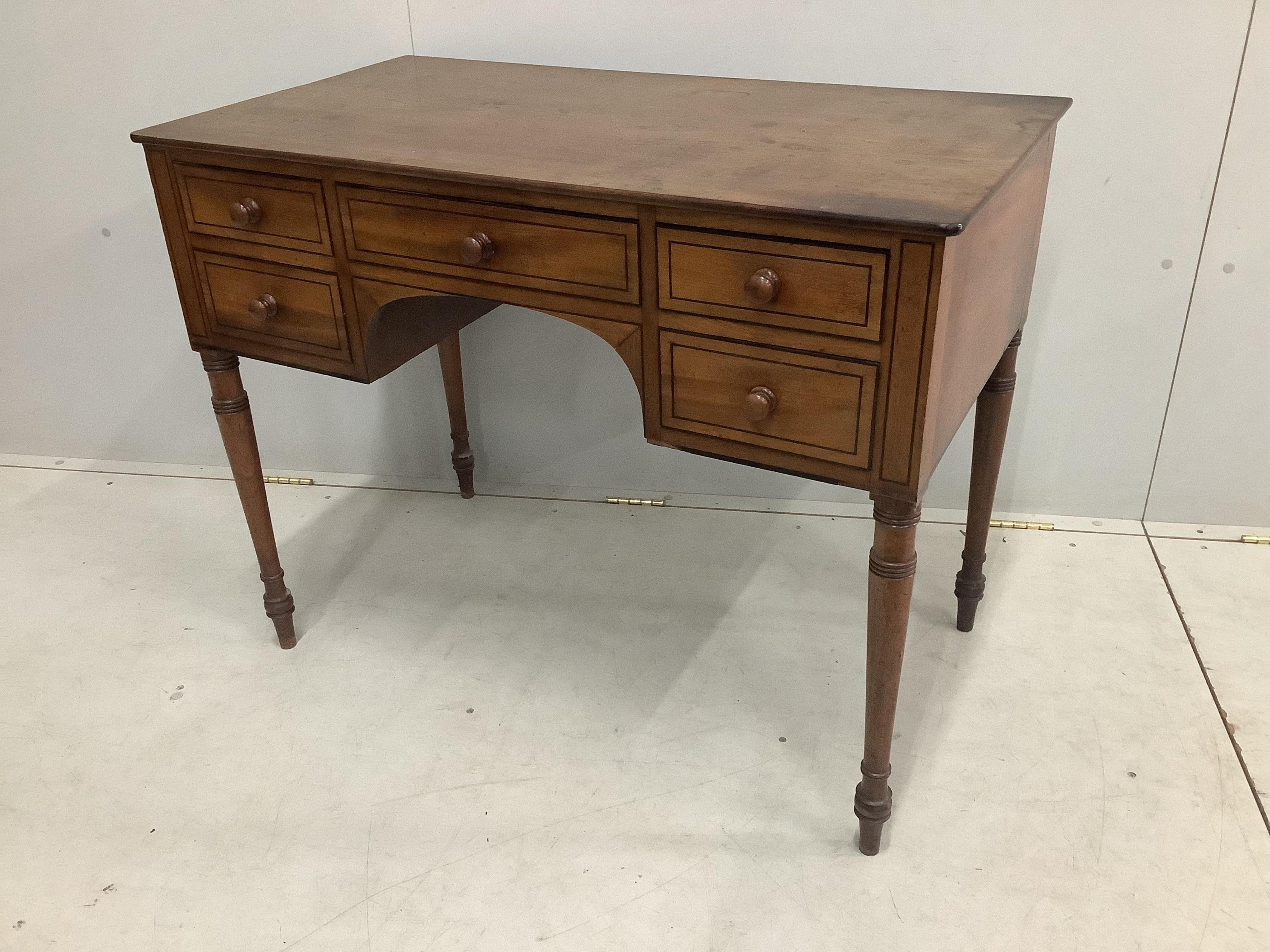 A Regency ebony strung mahogany kneehole dressing table, width 99cm, depth 55cm, height 78cm. Condition - fair